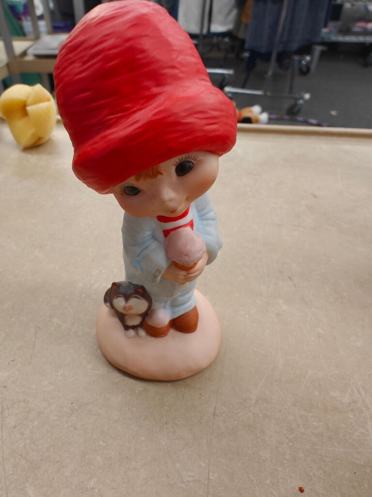 Child Figurine with Red Hat and Cat