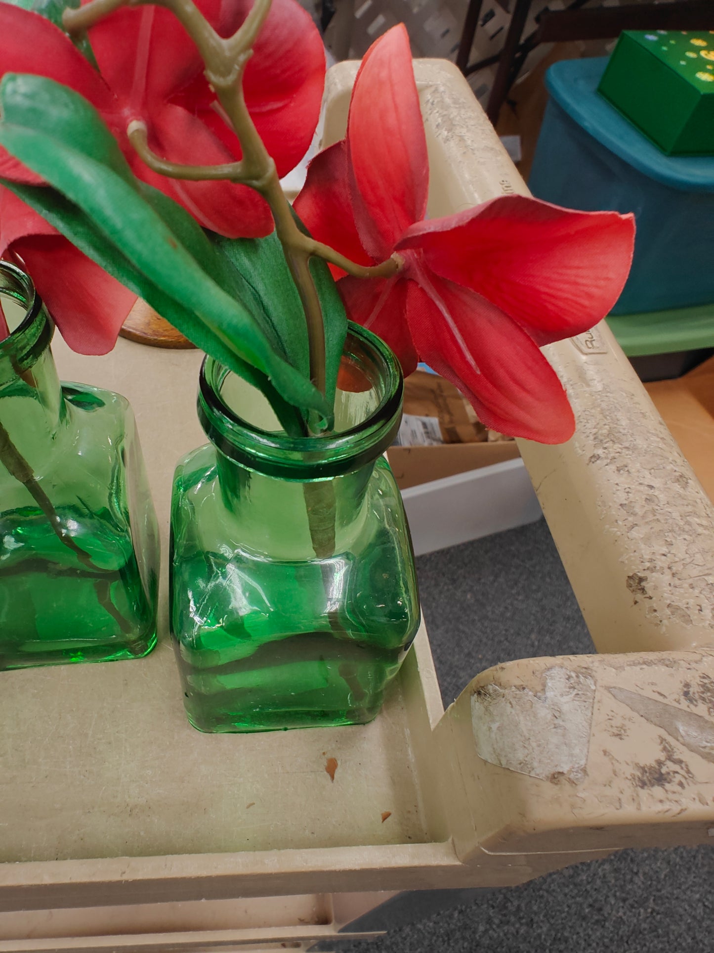 GREEN VASE WITH FLOWERS